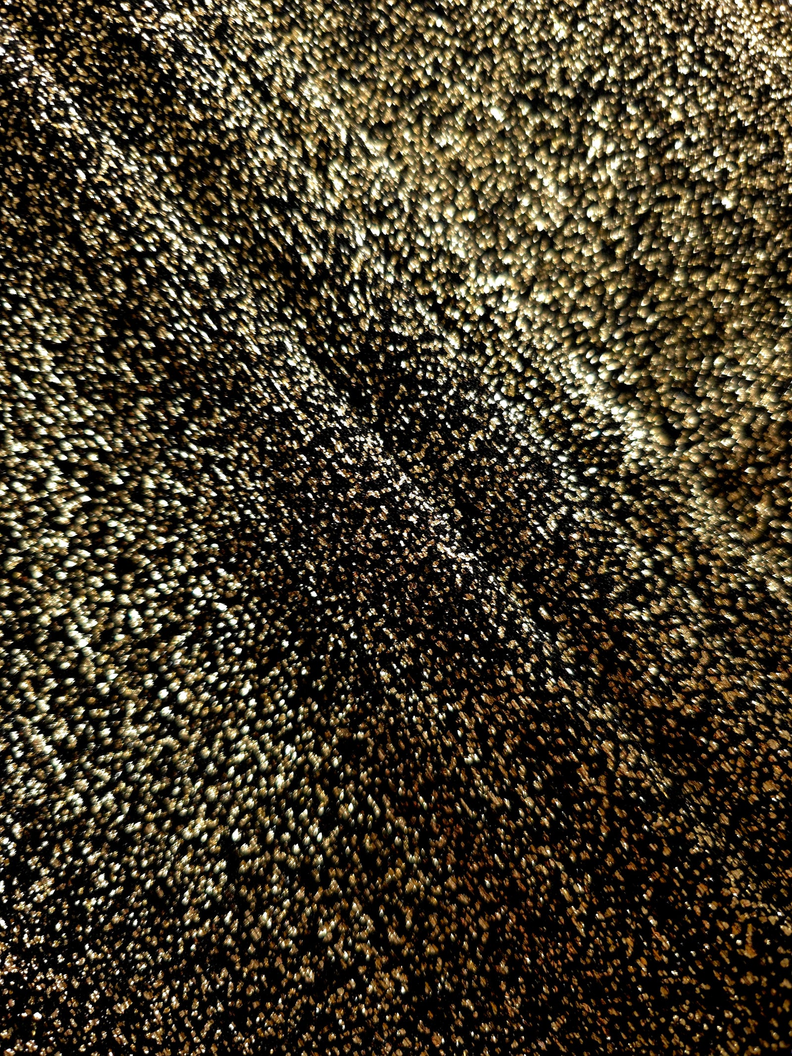 Layered Black Gold Sheer Glitter Stretch Tulle Fabric showing richer sparkle, soft depth and lightweight transparent folds