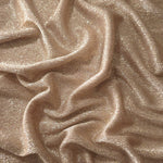 Draped Champagne Beige Sheer Glitter Stretch Tulle Fabric showing scattered sparkle across fluid folds for eveningwear and stage looks