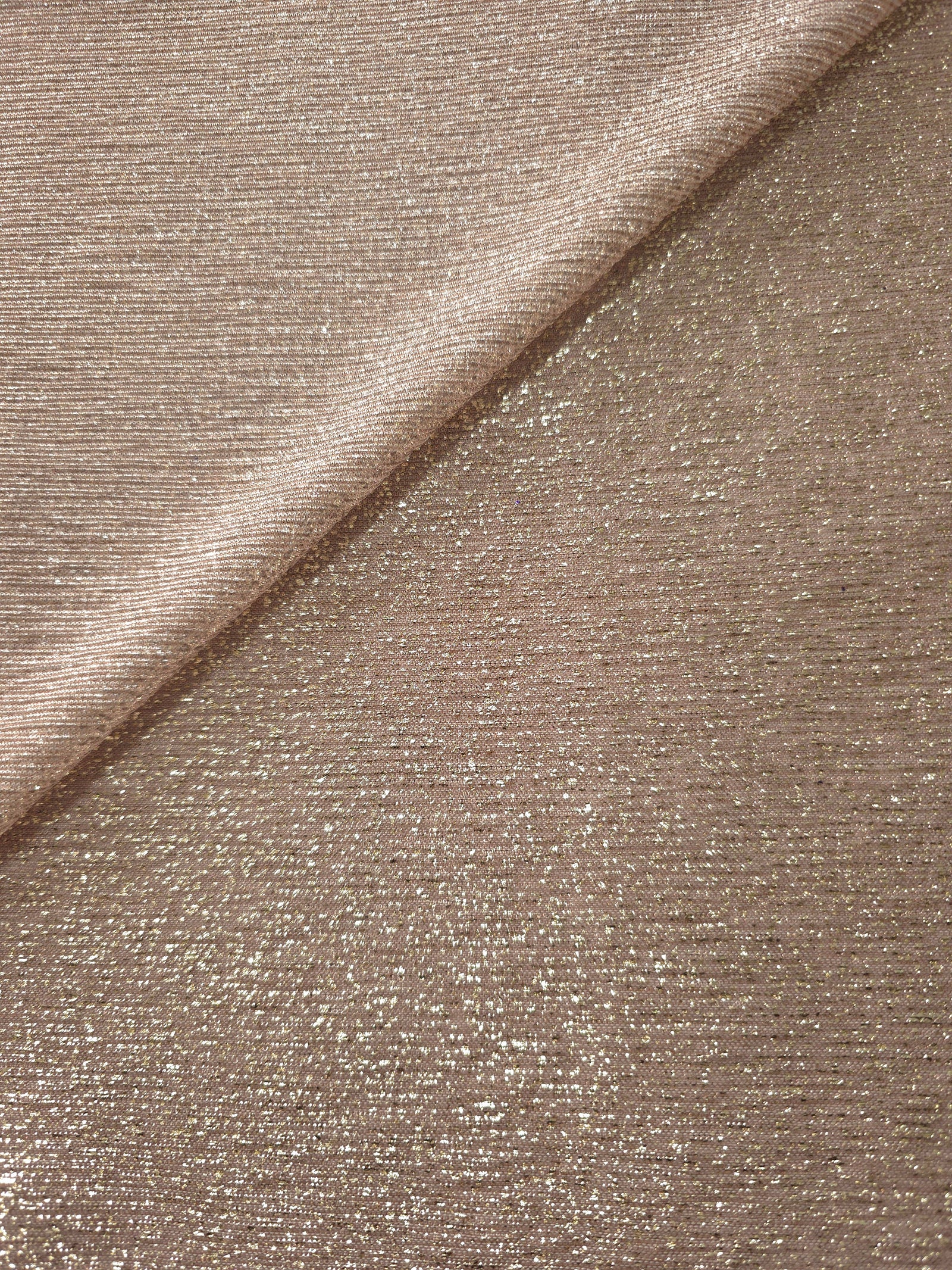 Front and back of Champagne Beige Sheer Glitter Stretch Tulle Fabric showing transparent knit construction and flexible 4-way stretch