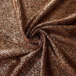 Swirl-draped Copper Bronze Sheer Glitter Stretch Tulle Fabric capturing reflective sparkle and fluid movement through flexible folds