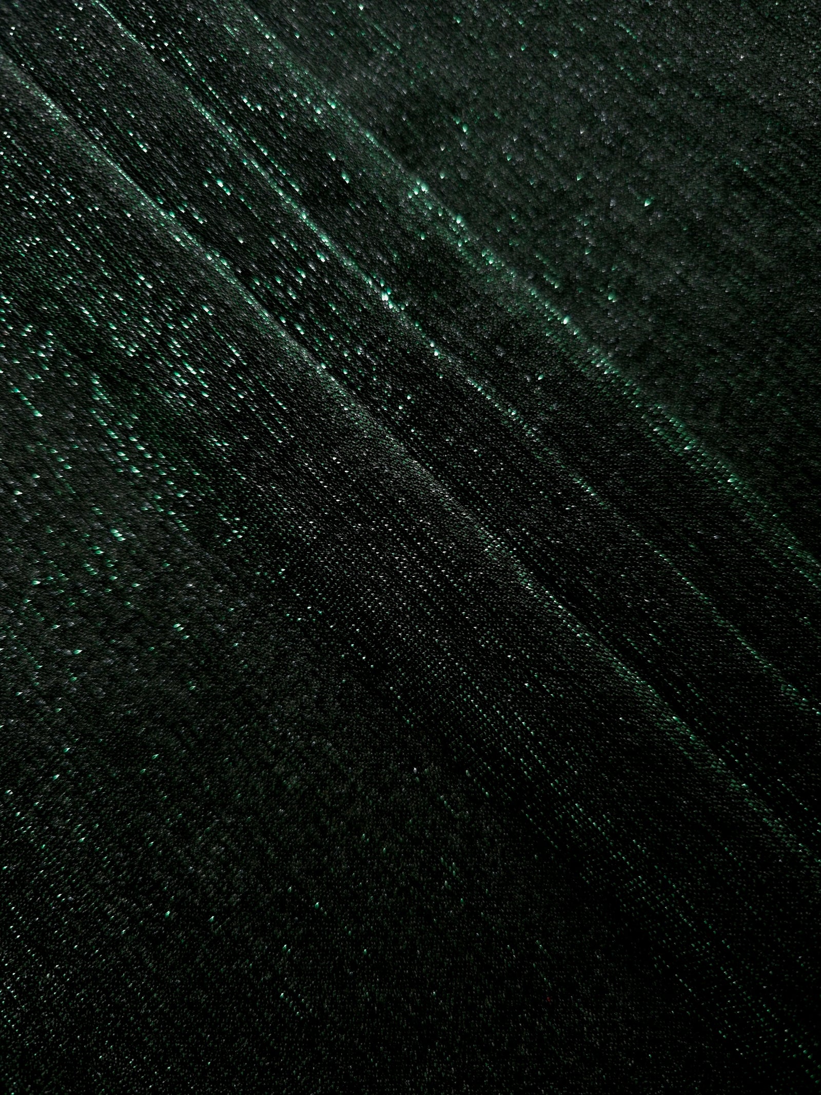 Layered Deep Emerald Sheer Glitter Stretch Tulle Fabric showing richer sparkle, soft depth and lightweight transparent folds