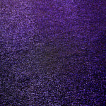 Surface detail of Deep Violet Sheer Glitter Stretch Tulle Fabric showing glitter coverage across the fine sheer tulle base