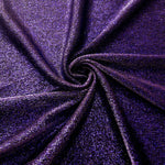 Swirl-draped Deep Violet Sheer Glitter Stretch Tulle Fabric capturing reflective sparkle and fluid movement through flexible folds