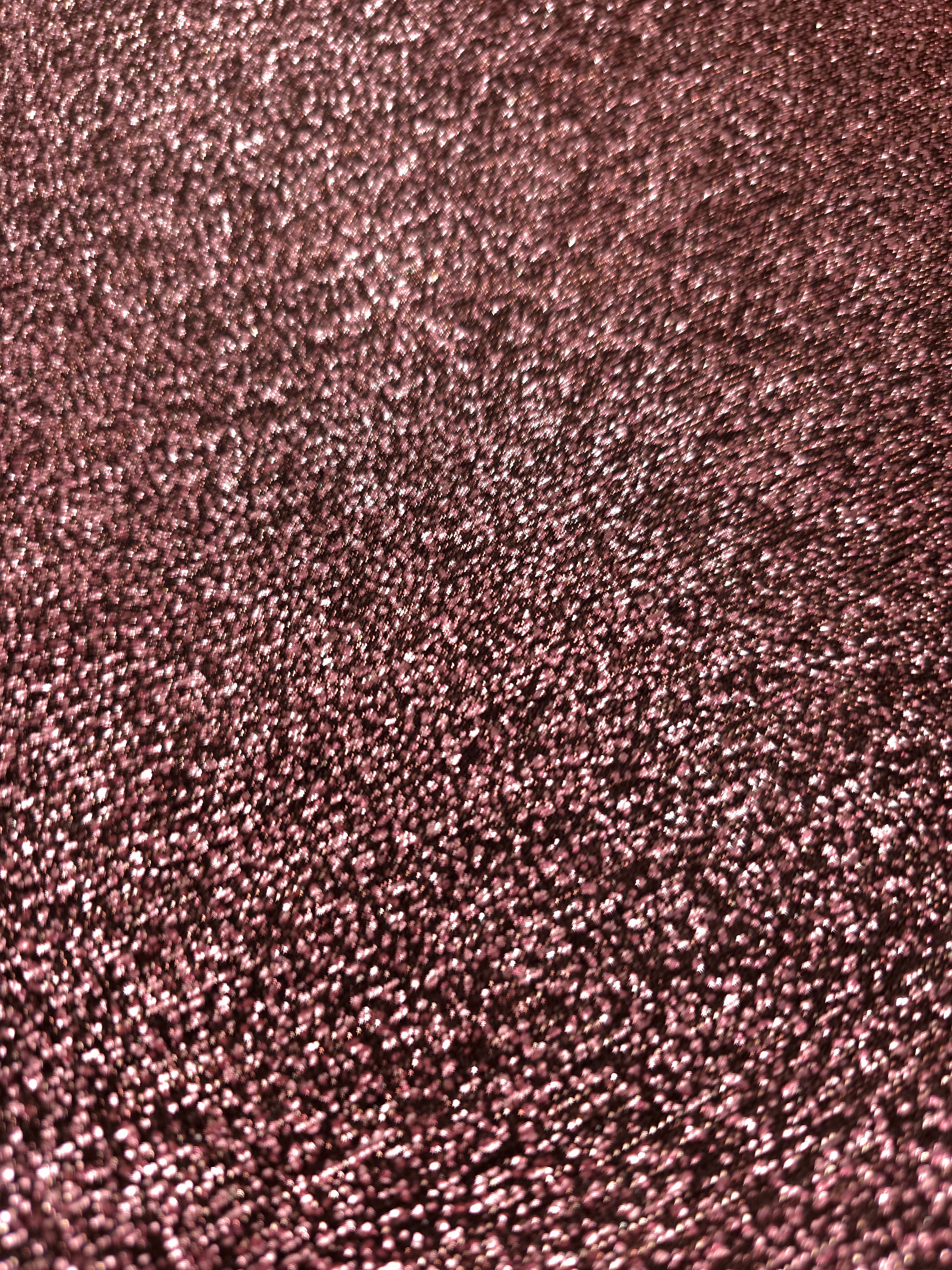 Close-up of Dusty Rose Sheer Glitter Stretch Tulle Fabric highlighting all-over glitter, fine mesh texture and airy transparency
