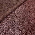 Front and back of Dusty Rose Sheer Glitter Stretch Tulle Fabric showing transparent knit construction and flexible 4-way stretch