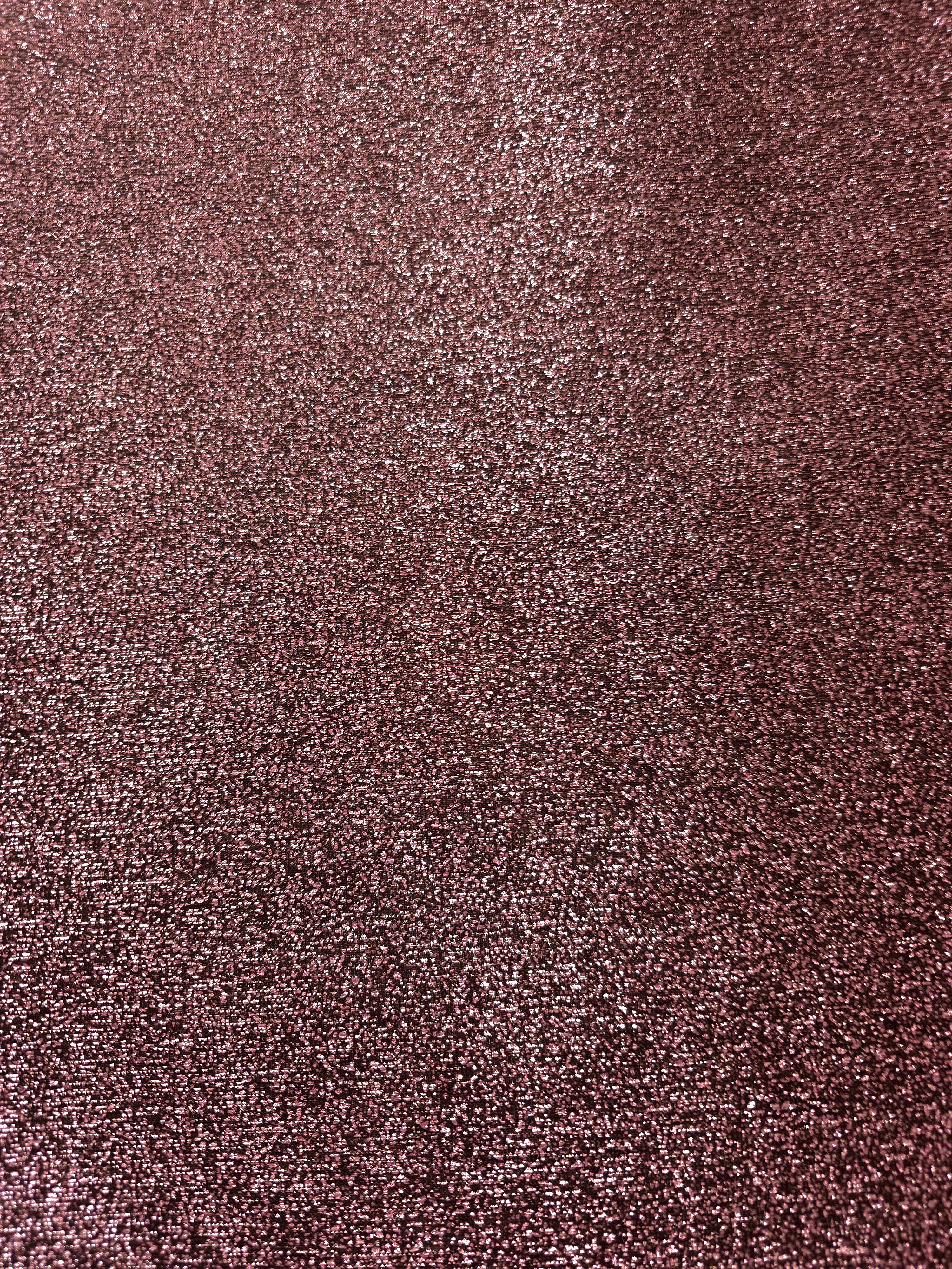 Surface detail of Dusty Rose Sheer Glitter Stretch Tulle Fabric showing glitter coverage across the fine sheer tulle base