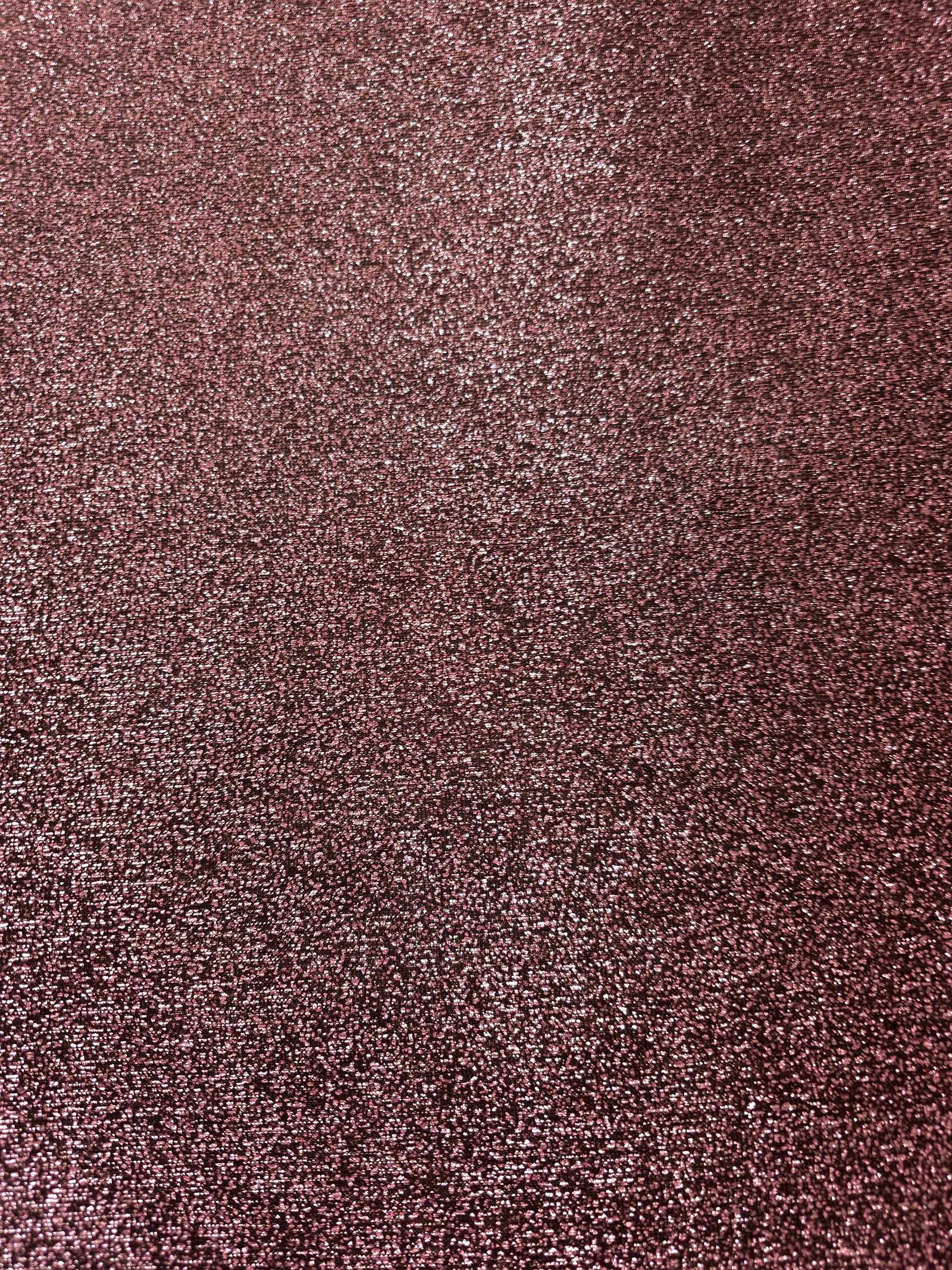 Surface detail of Dusty Rose Sheer Glitter Stretch Tulle Fabric showing glitter coverage across the fine sheer tulle base
