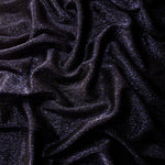Draped Midnight Navy Sheer Glitter Stretch Tulle Fabric showing scattered sparkle across fluid folds for eveningwear and stage looks