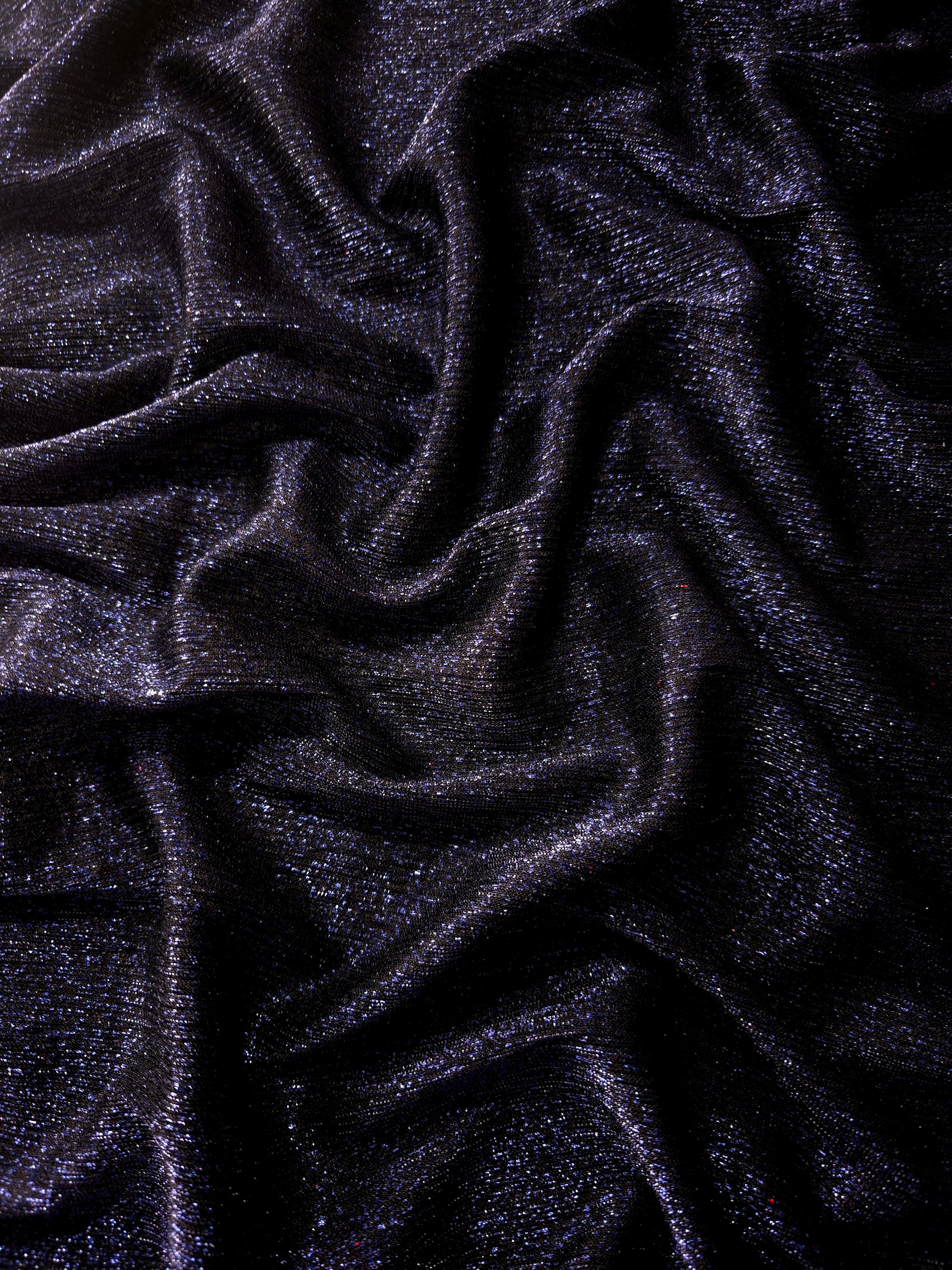 Draped Midnight Navy Sheer Glitter Stretch Tulle Fabric showing scattered sparkle across fluid folds for eveningwear and stage looks