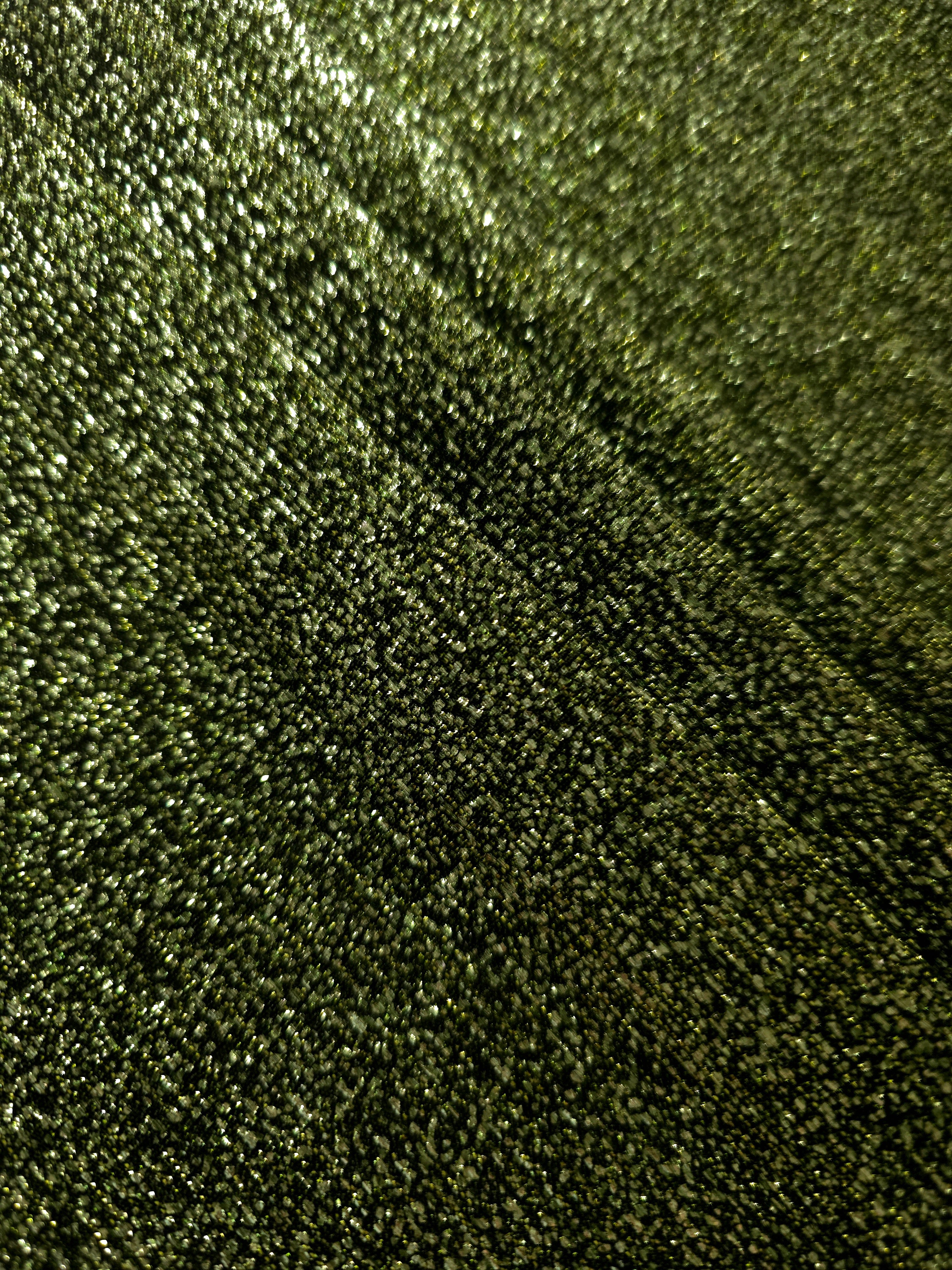 Layered Olive Green Sheer Glitter Stretch Tulle Fabric showing richer sparkle, soft depth and lightweight transparent folds