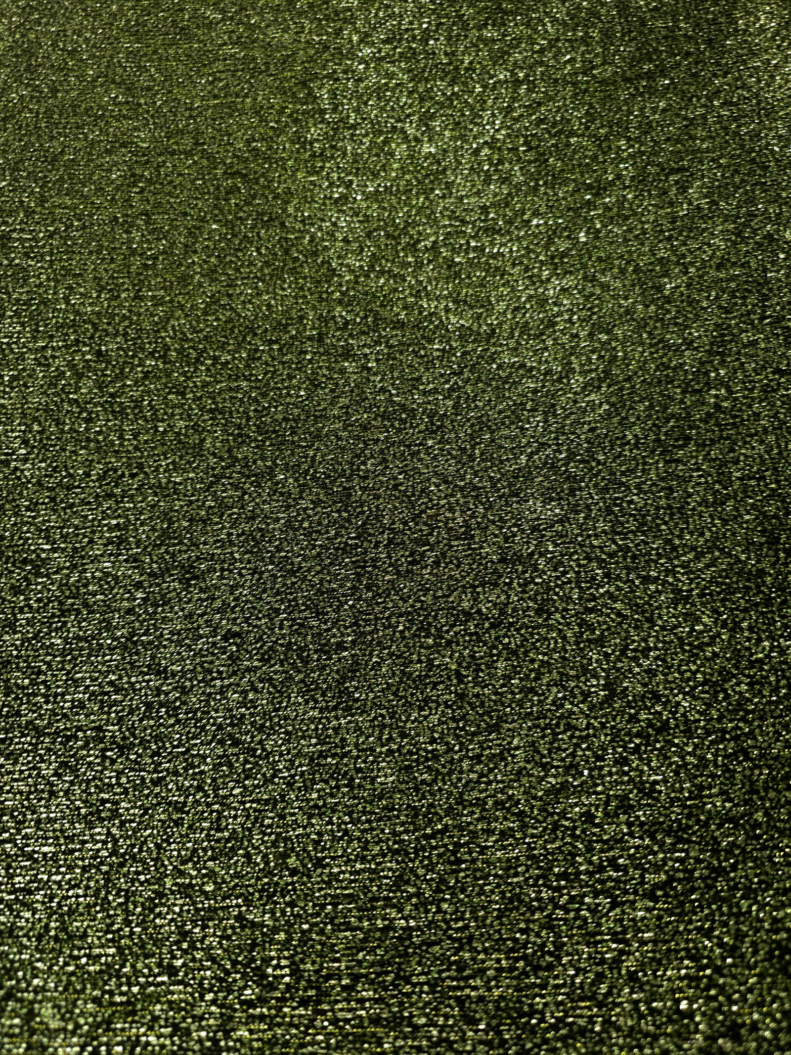 Surface detail of Olive Green Sheer Glitter Stretch Tulle Fabric showing glitter coverage across the fine sheer tulle base