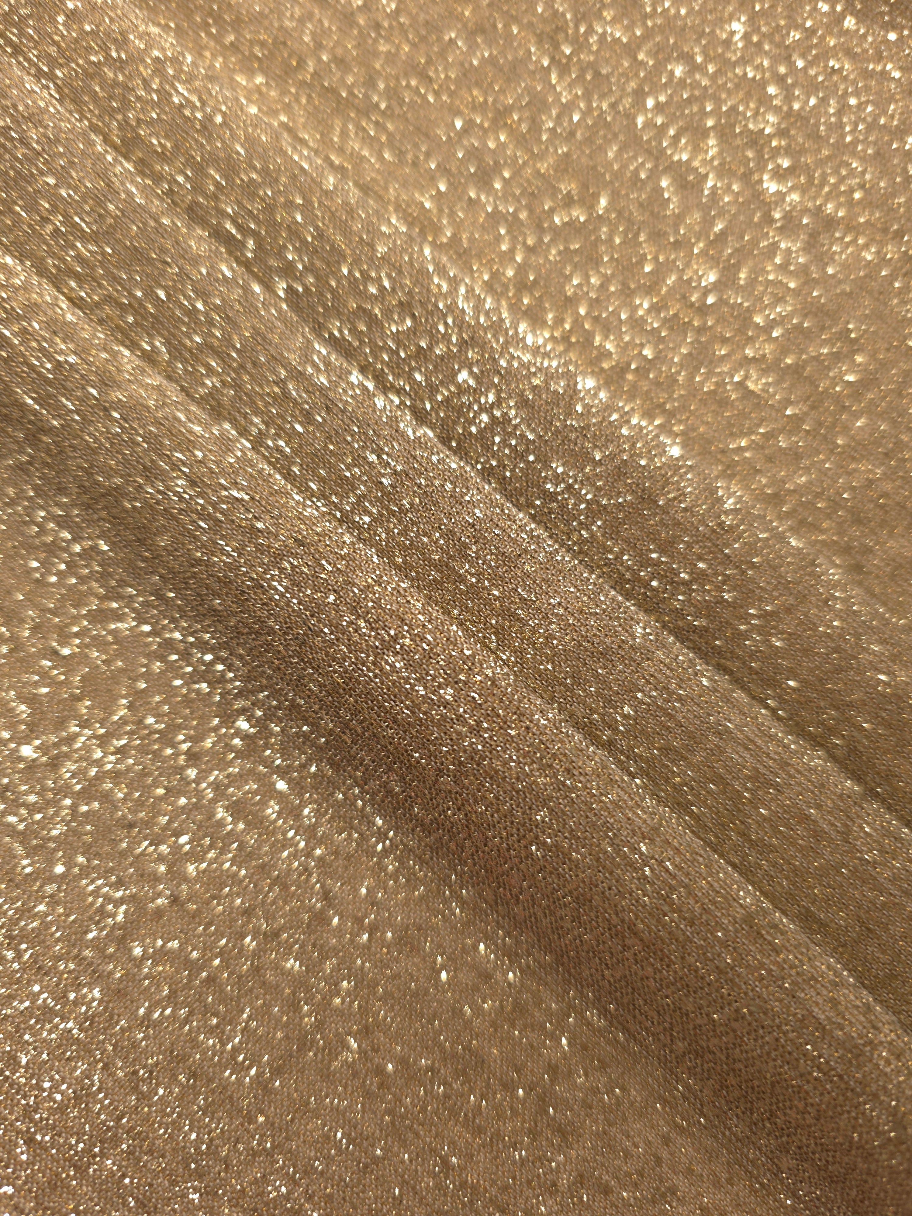 Layered Pale Gold Sheer Glitter Stretch Tulle Fabric showing richer sparkle, soft depth and lightweight transparent folds