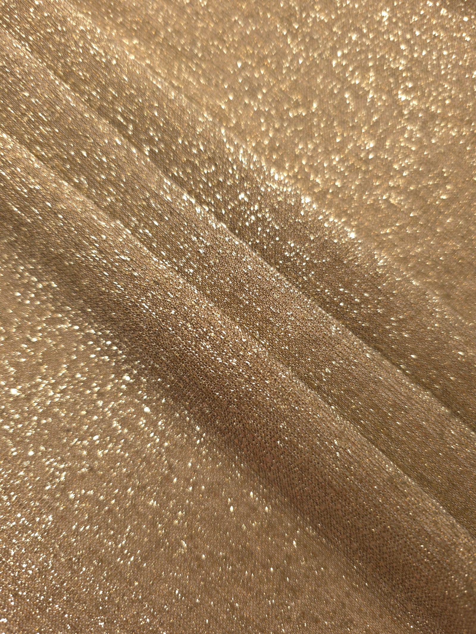 Layered Pale Gold Sheer Glitter Stretch Tulle Fabric showing richer sparkle, soft depth and lightweight transparent folds