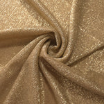 Swirl-draped Pale Gold Sheer Glitter Stretch Tulle Fabric capturing reflective sparkle and fluid movement through flexible folds