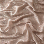 Draped Rose Taupe Sheer Glitter Stretch Tulle Fabric showing scattered sparkle across fluid folds for eveningwear and stage looks