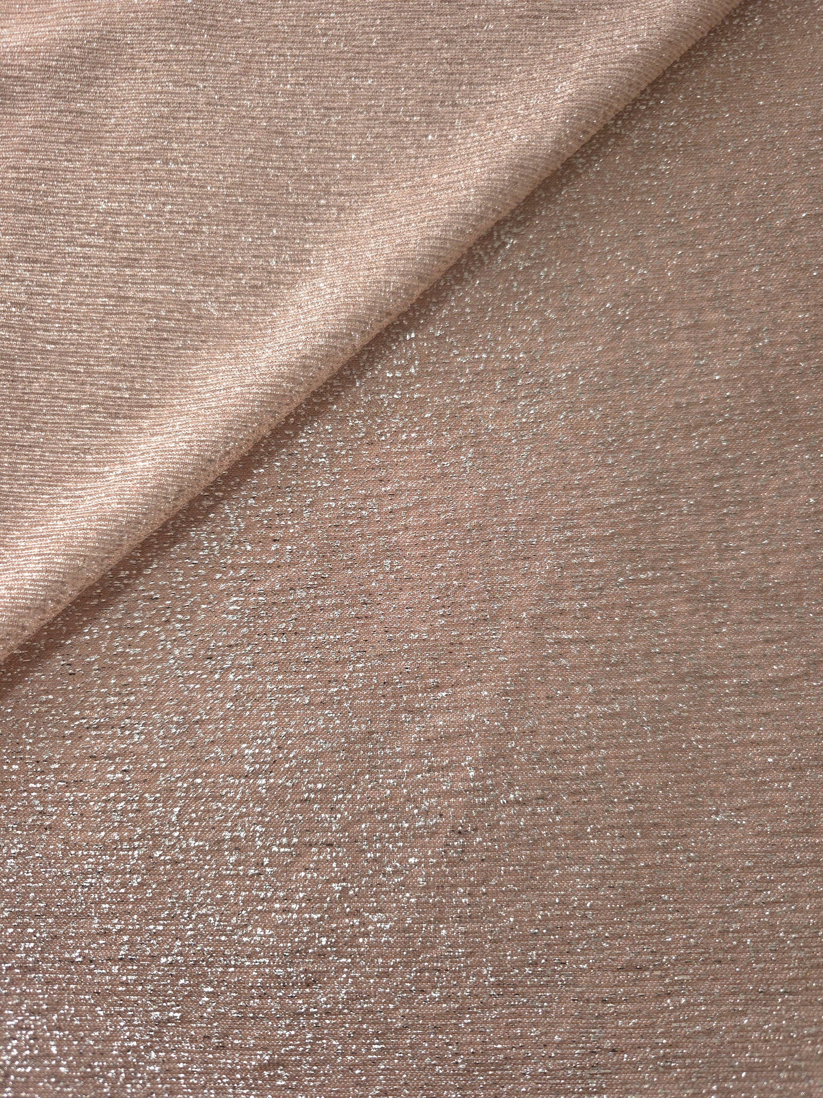 Front and back of Rose Taupe Sheer Glitter Stretch Tulle Fabric showing transparent knit construction and flexible 4-way stretch