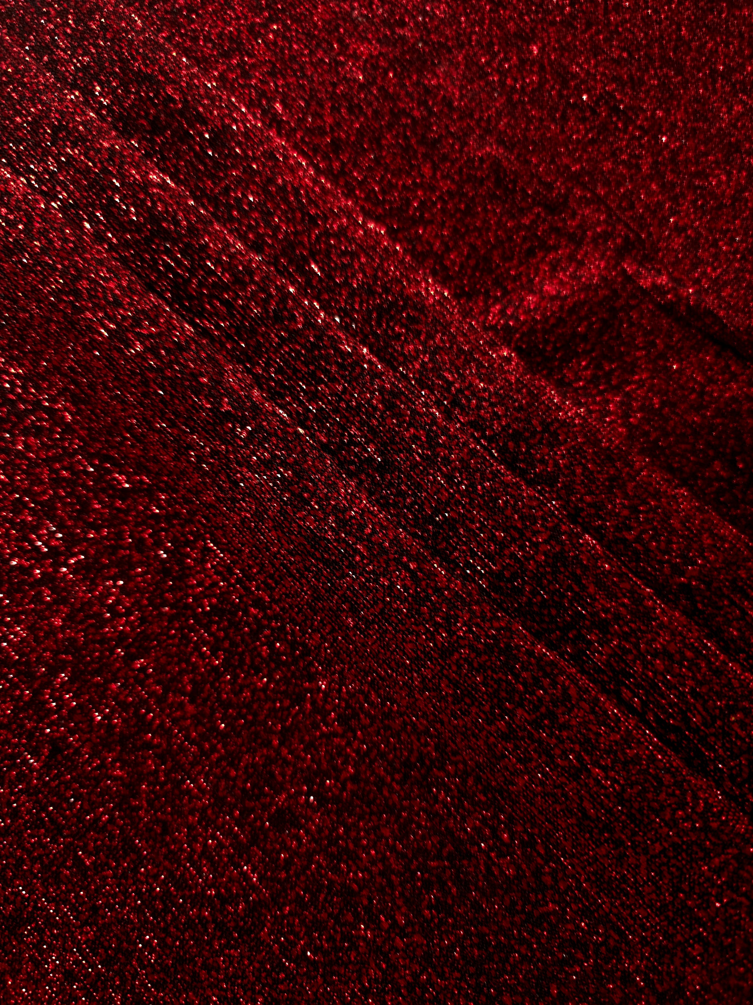 Layered Ruby Red Sheer Glitter Stretch Tulle Fabric showing richer sparkle, soft depth and lightweight transparent folds