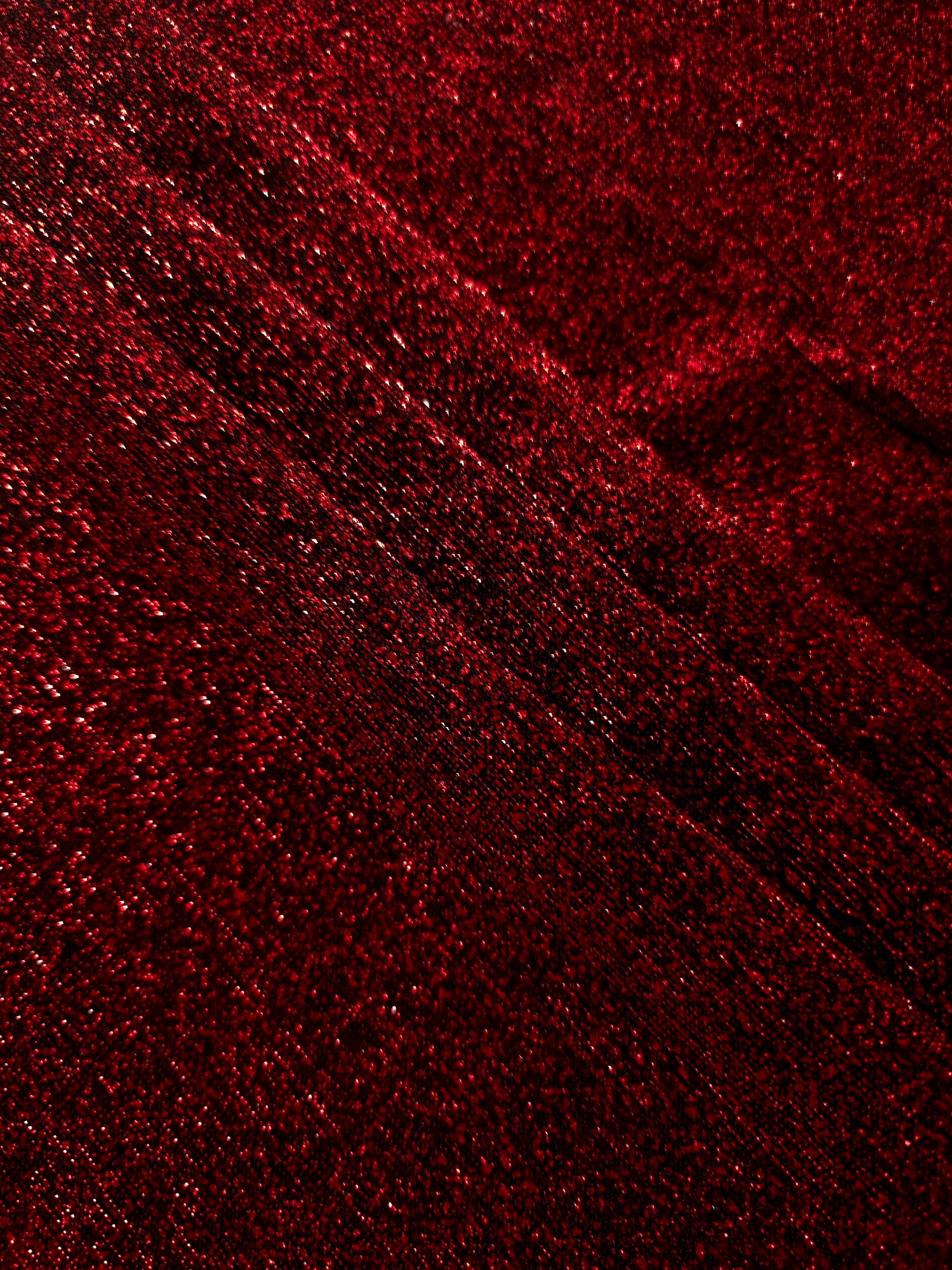 Layered Ruby Red Sheer Glitter Stretch Tulle Fabric showing richer sparkle, soft depth and lightweight transparent folds