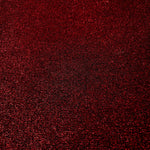 Surface detail of Ruby Red Sheer Glitter Stretch Tulle Fabric showing glitter coverage across the fine sheer tulle base