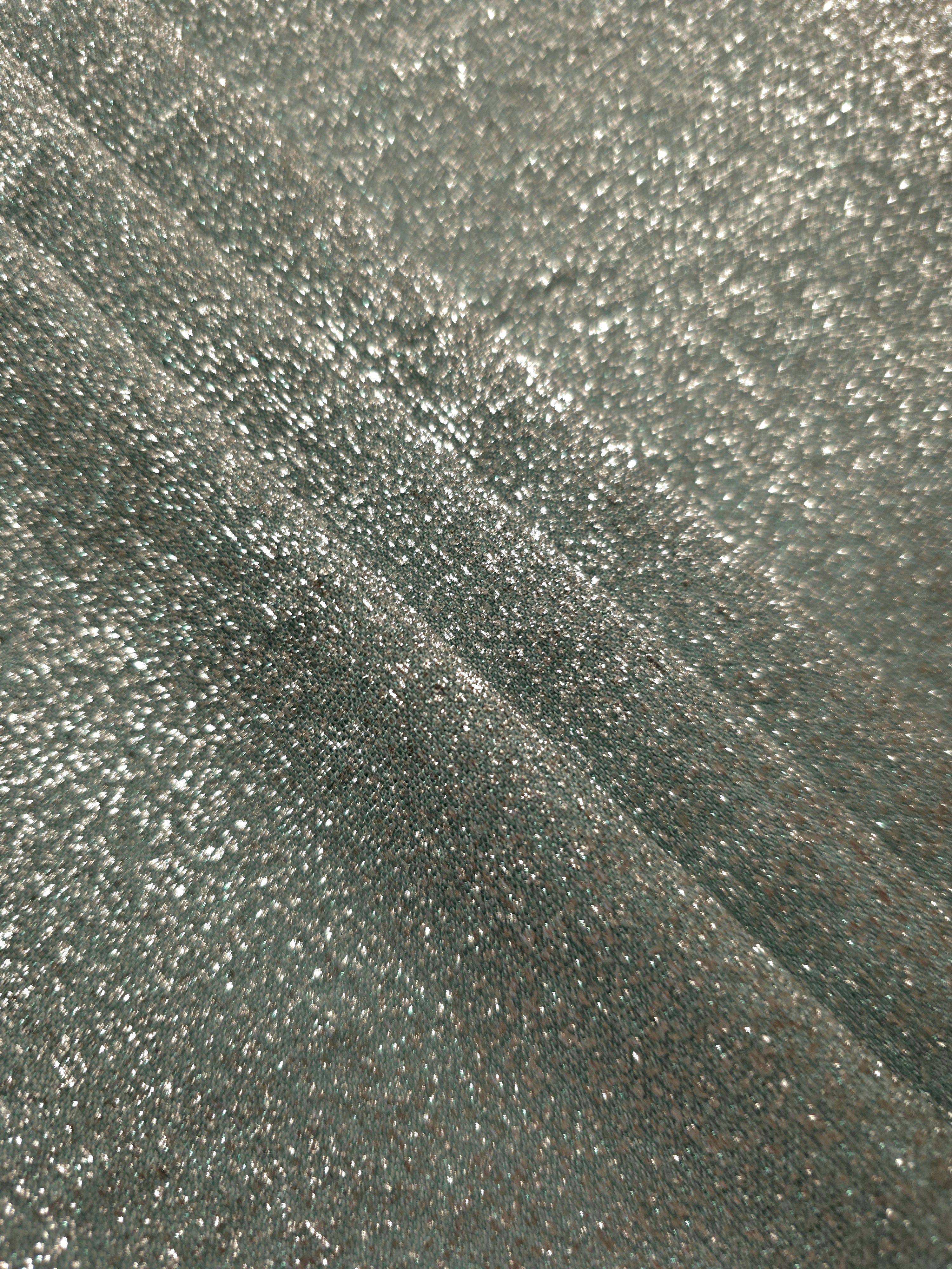 Layered Silver Sage Sheer Glitter Stretch Tulle Fabric showing richer sparkle, soft depth and lightweight transparent folds