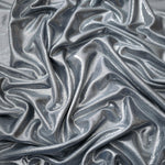Softly draped Steel Gray foiled spandex fabric showing fluid shape and metallic shimmer for dresses, stage costumes and eventwear