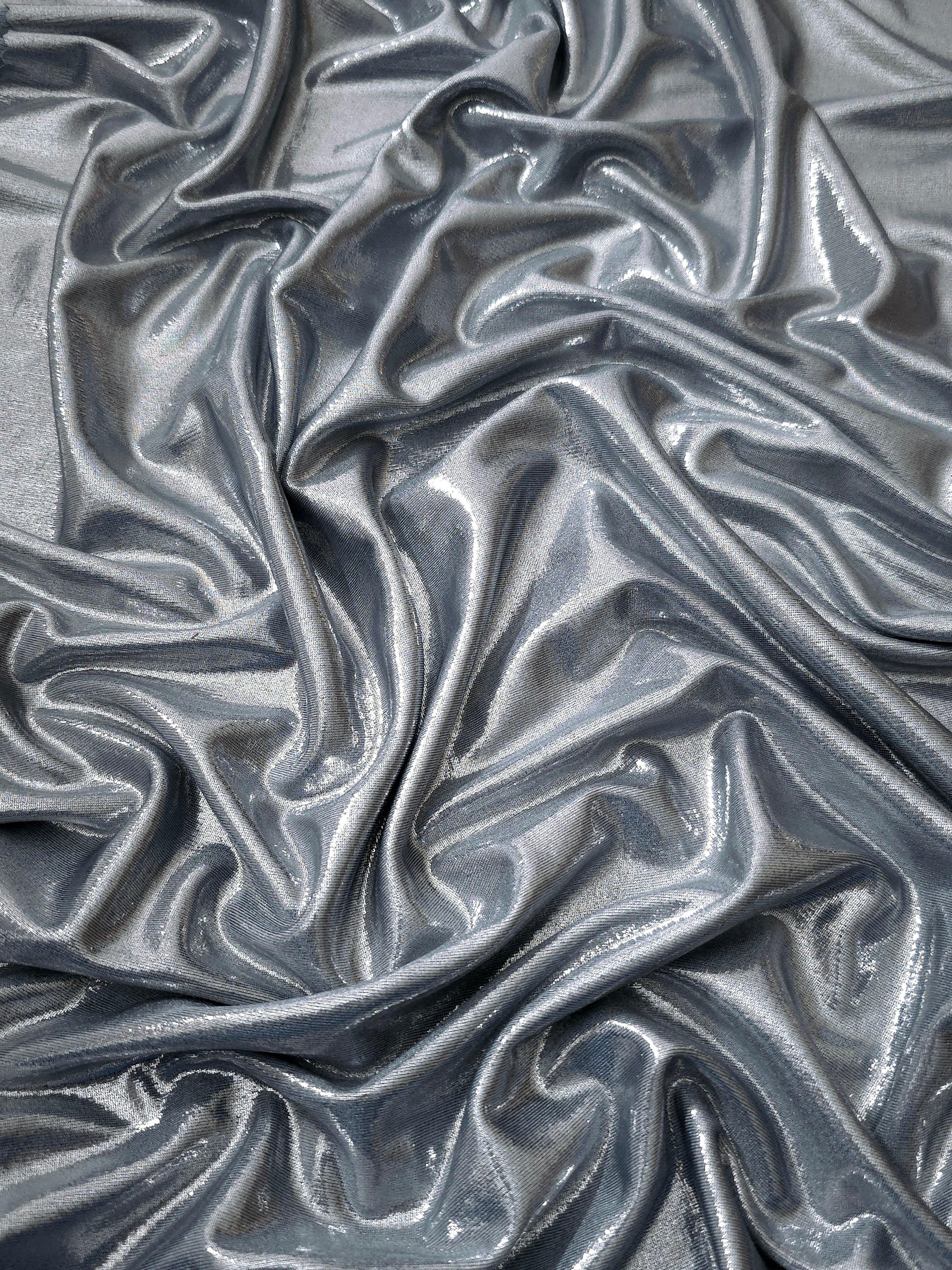 Softly draped Steel Gray foiled spandex fabric showing fluid shape and metallic shimmer for dresses, stage costumes and eventwear