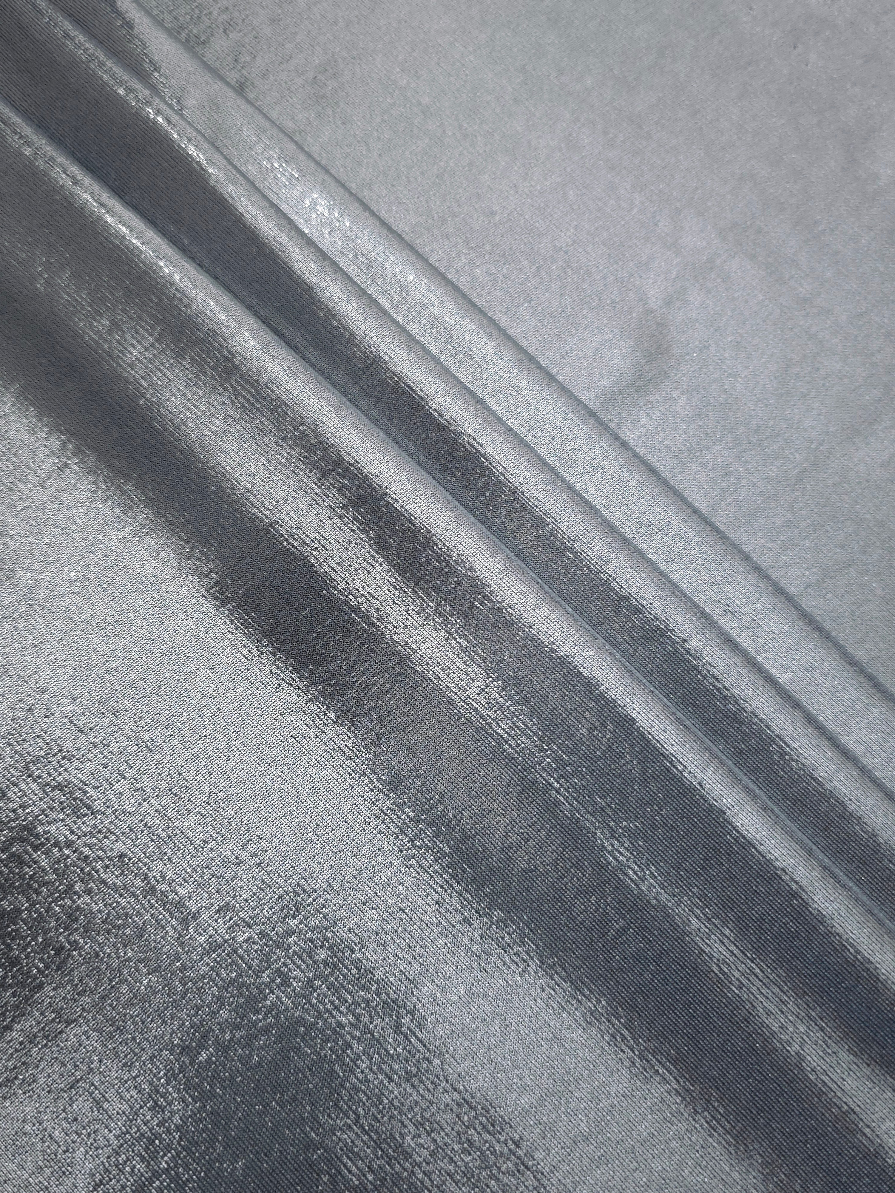 Steel Gray foiled spandex arranged in layered folds, displaying shimmer and soft structure for skirts, tops and performancewear