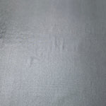 Flat Steel Gray foiled stretch fabric with bright metallic reflection, ideal for performancewear, evening pieces and creative sewing