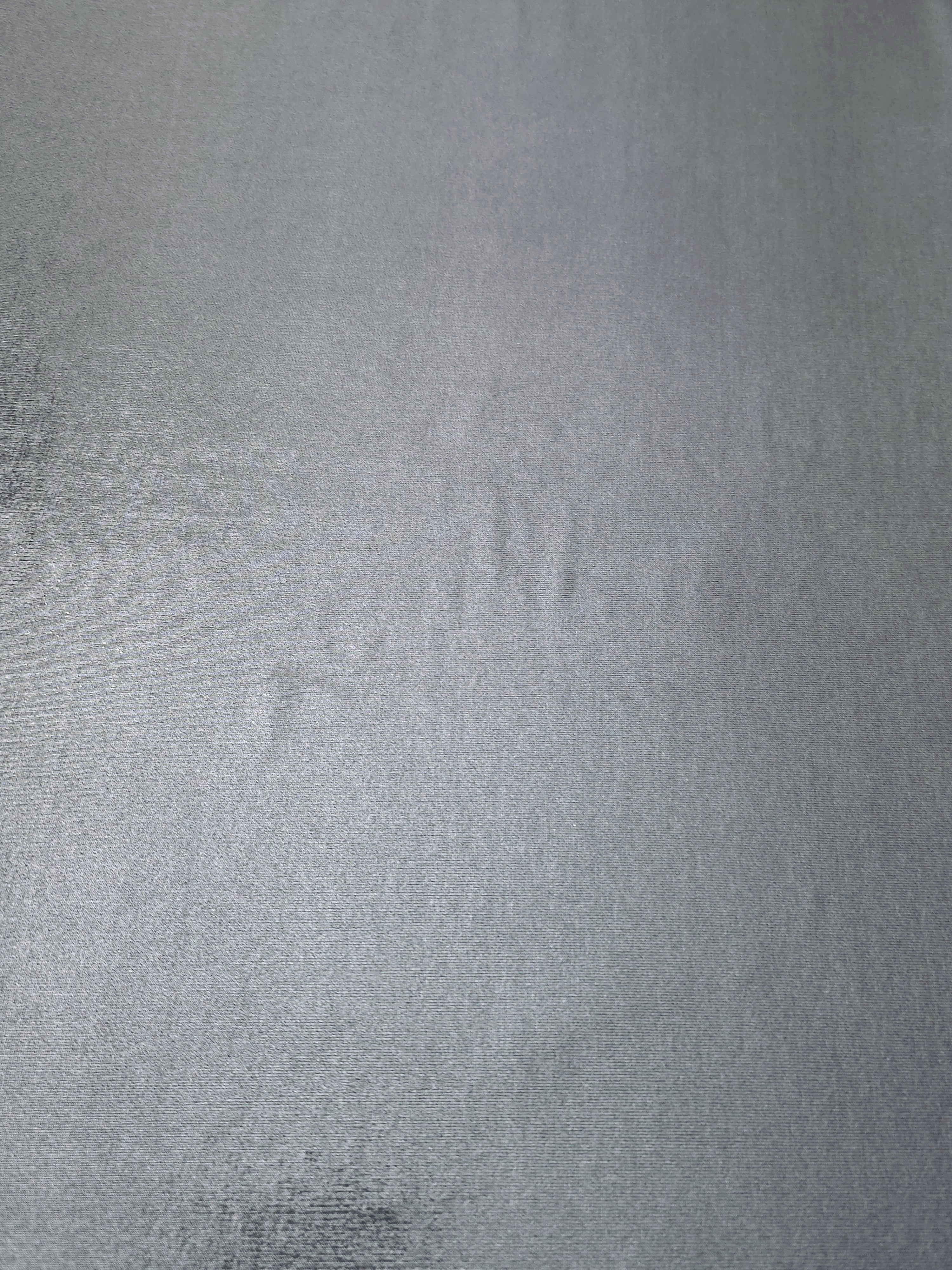 Flat Steel Gray foiled stretch fabric with bright metallic reflection, ideal for performancewear, evening pieces and creative sewing