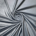 Flowing swirl of Steel Gray metallic stretch fabric, showing dynamic foil reflection for stagewear, skirts and creative fashion