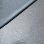 Softly folded Steel Gray foiled spandex showing metallic shine and flexible hand for costumes, eveningwear and creative sewing