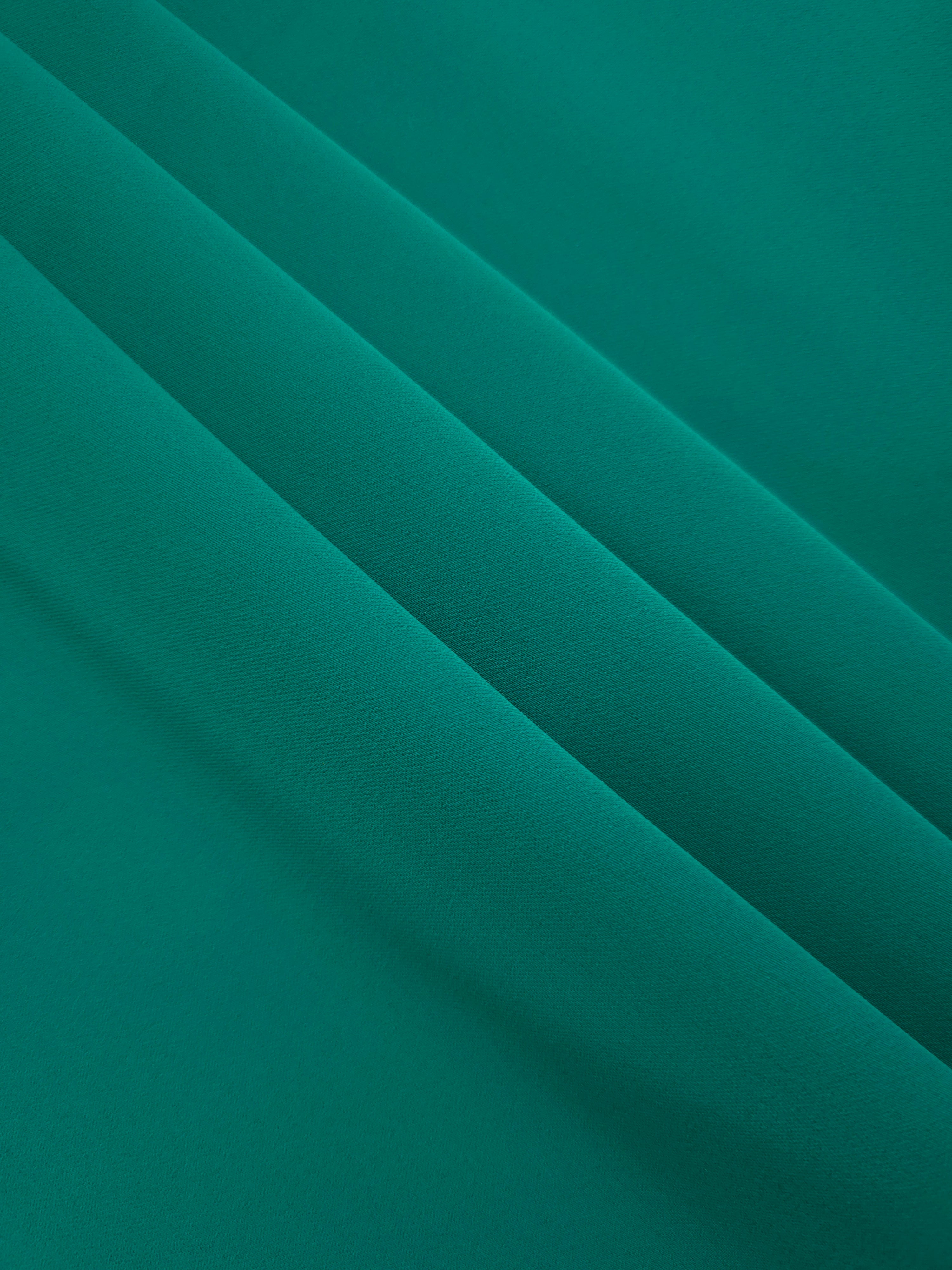 Teal Green mechanical polyester crepe layered to show soft structure for tailored garments and separates