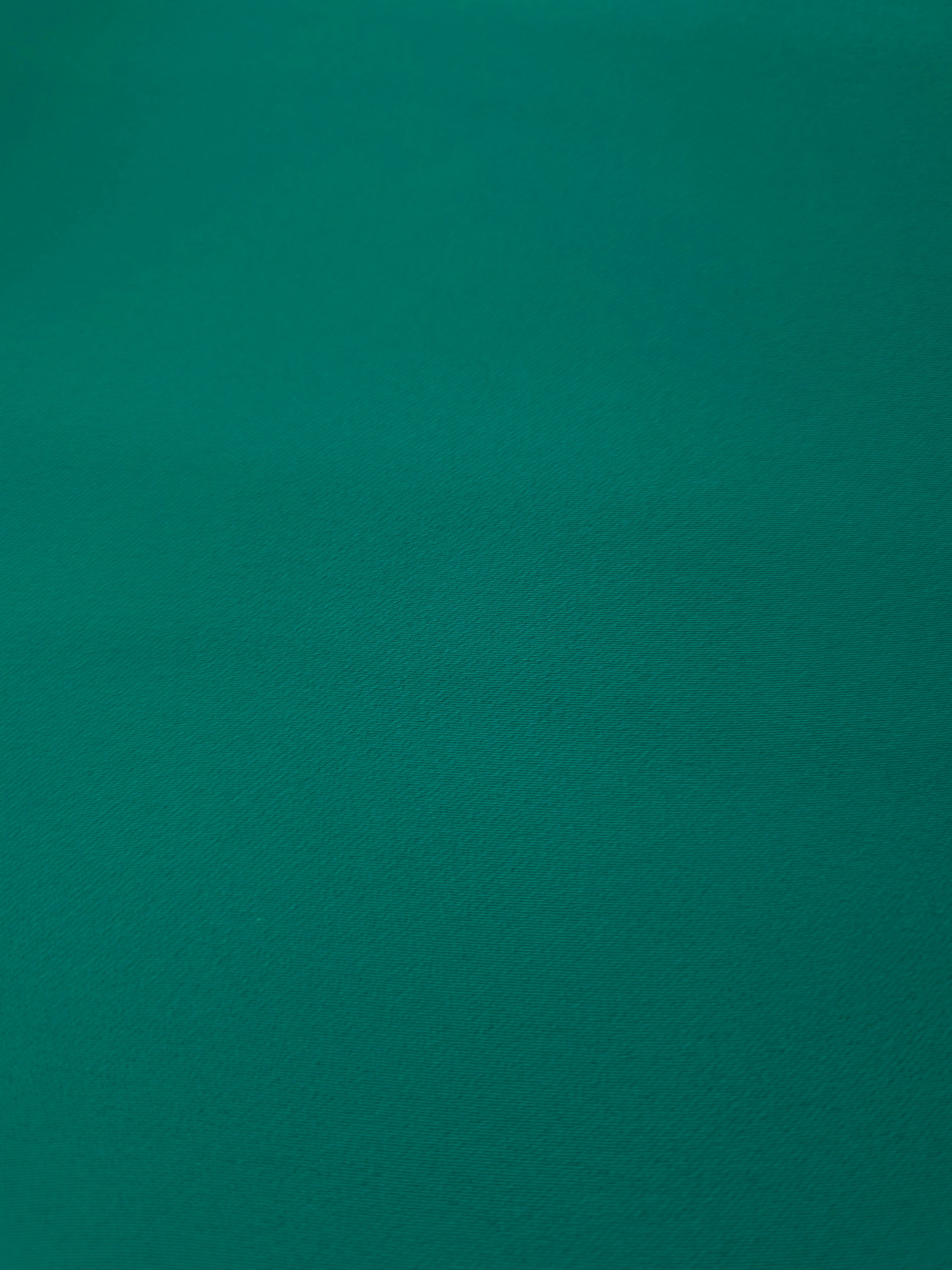 Close woven detail of Teal Green polyester crepe showing smooth texture and a refined silky-feel finish