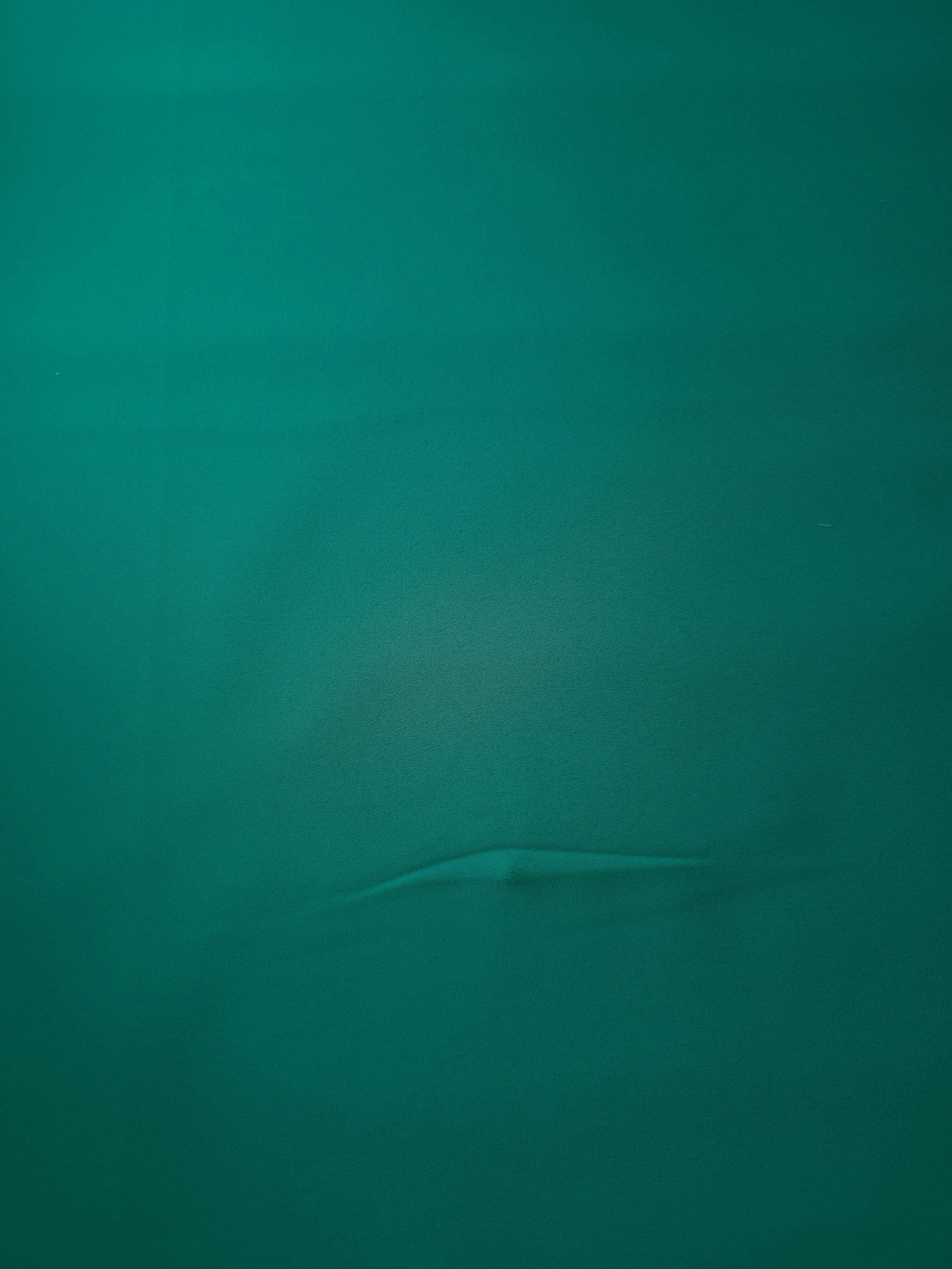 Surface view of Teal Green Italian polyester crepe, smooth woven fabric for dresses, blouses and separates