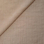 Close-up of Soft Beige Tencel jacquard showing tonal leaf texture and light weave.