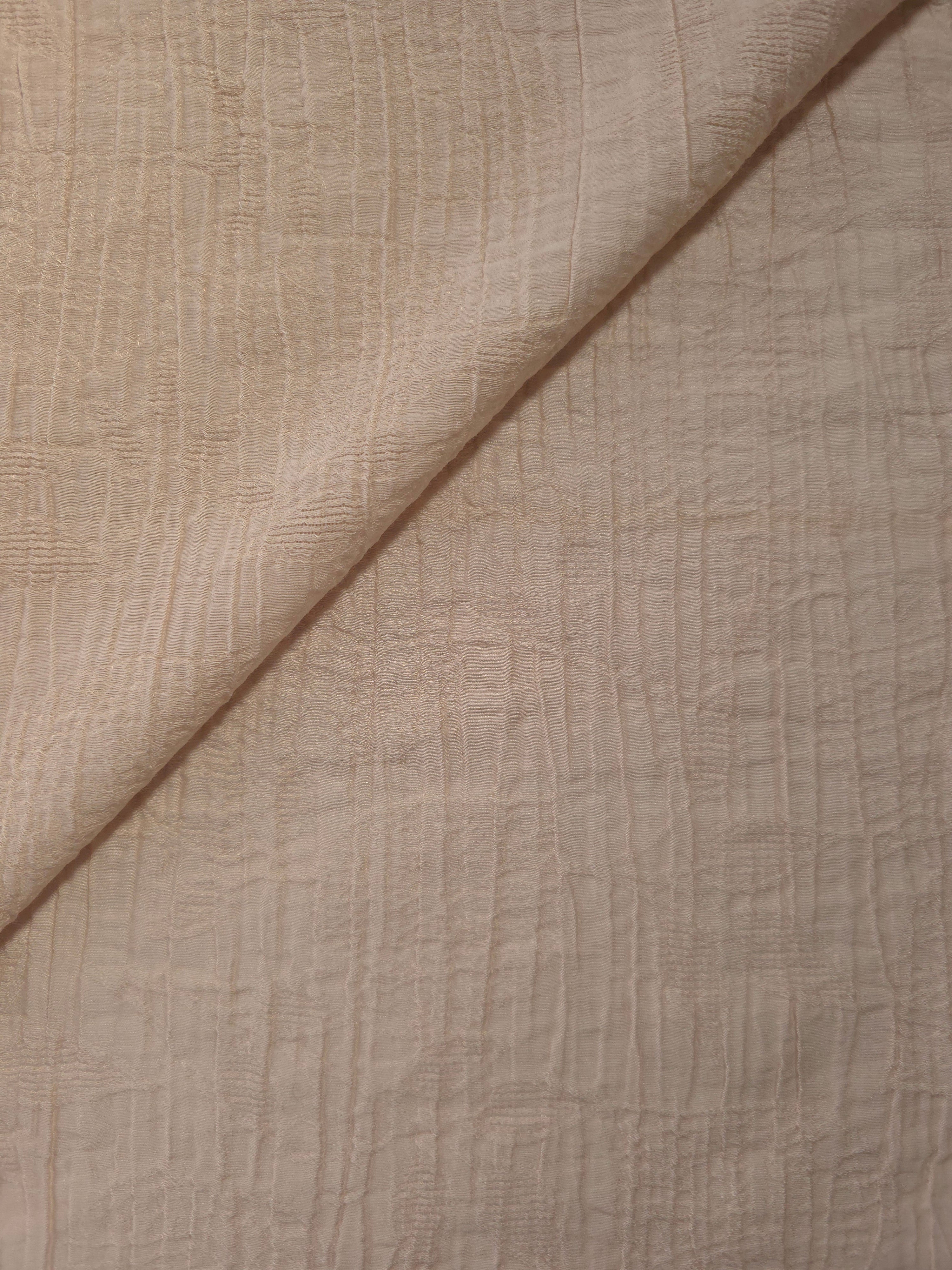 Close-up of Soft Beige Tencel jacquard showing tonal leaf texture and light weave.