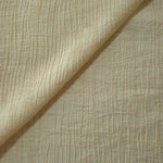 Flat view of Butter Yellow Tencel jacquard with tonal leaf texture for dresses and layers.