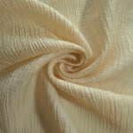 Folded Butter Yellow Tencel jacquard with tonal leaf texture for blouse and skirt layers.