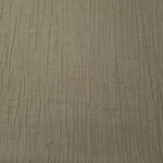 Flat view of Sage Green Tencel jacquard with fine root line texture for dresses and layers.