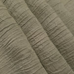 Draped Sage Green Tencel jacquard showing airy movement for kaftans and dresses.