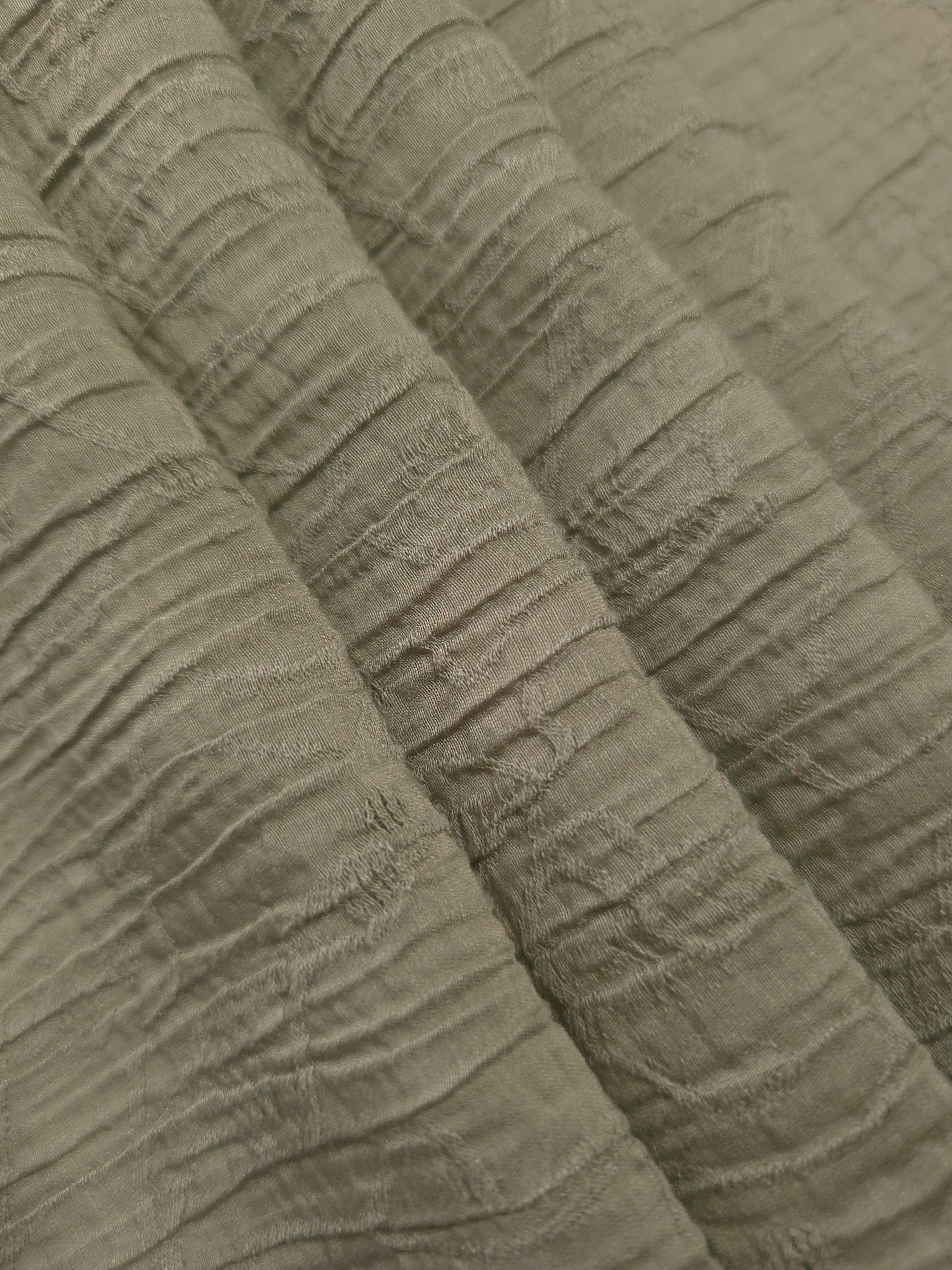 Draped Sage Green Tencel jacquard showing airy movement for kaftans and dresses.