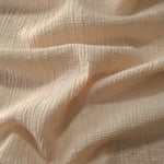 Folded Soft Beige Tencel jacquard with tonal stripe texture for blouse and skirt layers.