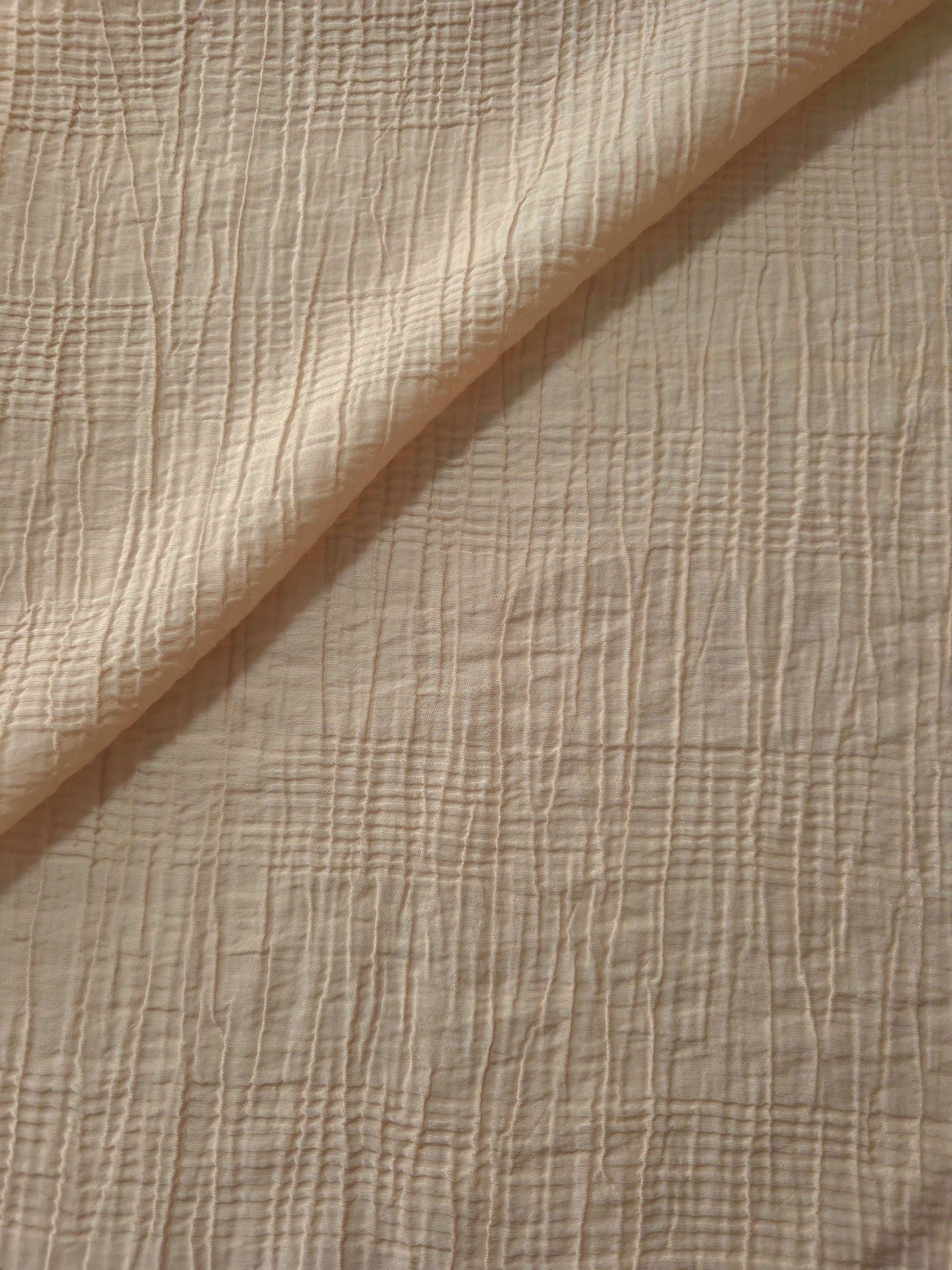 Draped Soft Beige Tencel jacquard showing airy movement for kaftans and dresses.