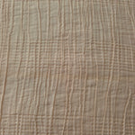 Detail view of Soft Beige Tencel jacquard with tonal stripe texture for soft layers.