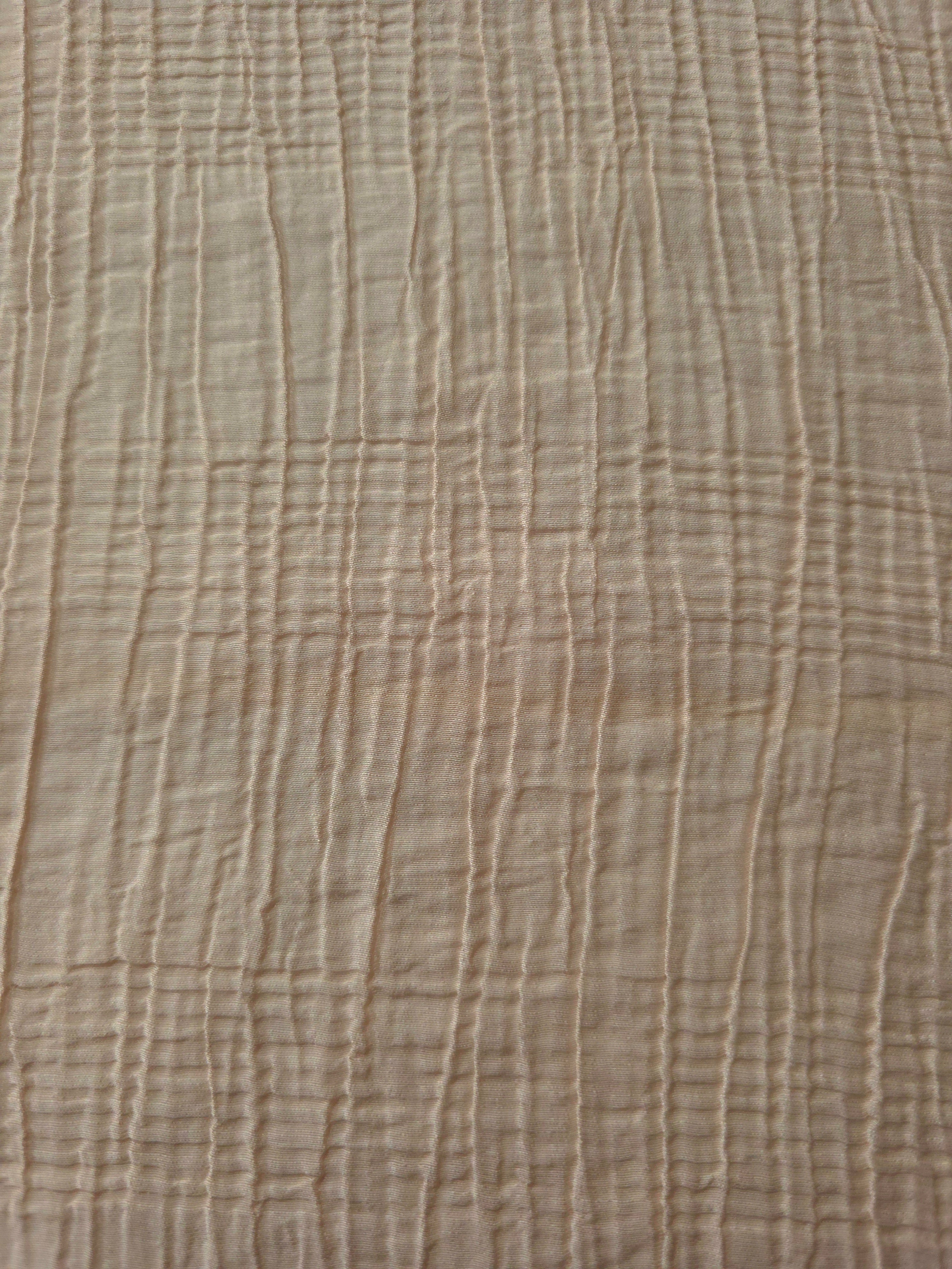 Detail view of Soft Beige Tencel jacquard with tonal stripe texture for soft layers.