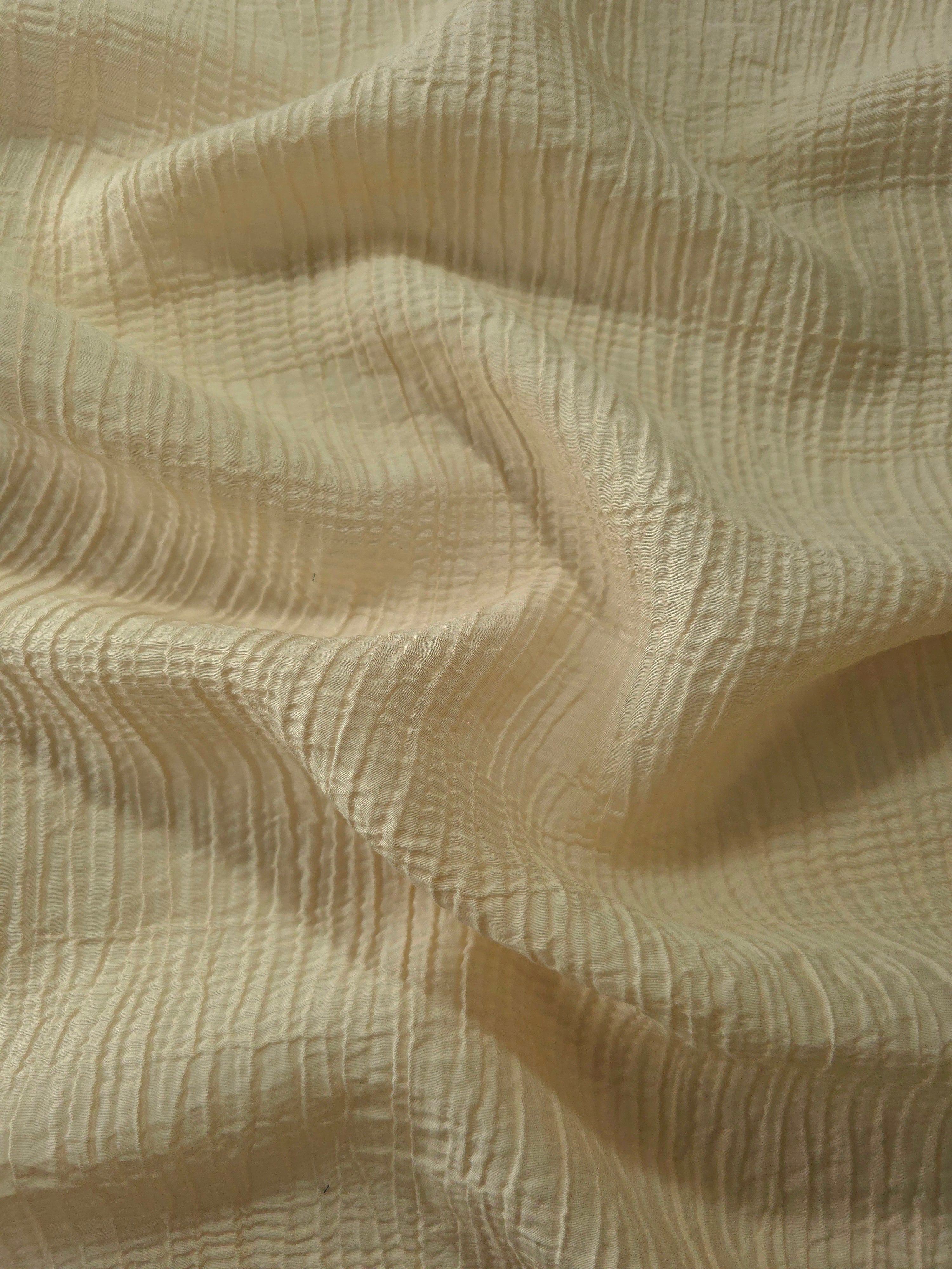 Close-up of Butter Yellow Tencel jacquard showing tonal stripe texture and light weave.