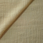 Folded Butter Yellow Tencel jacquard with tonal stripe texture for blouse and skirt layers.