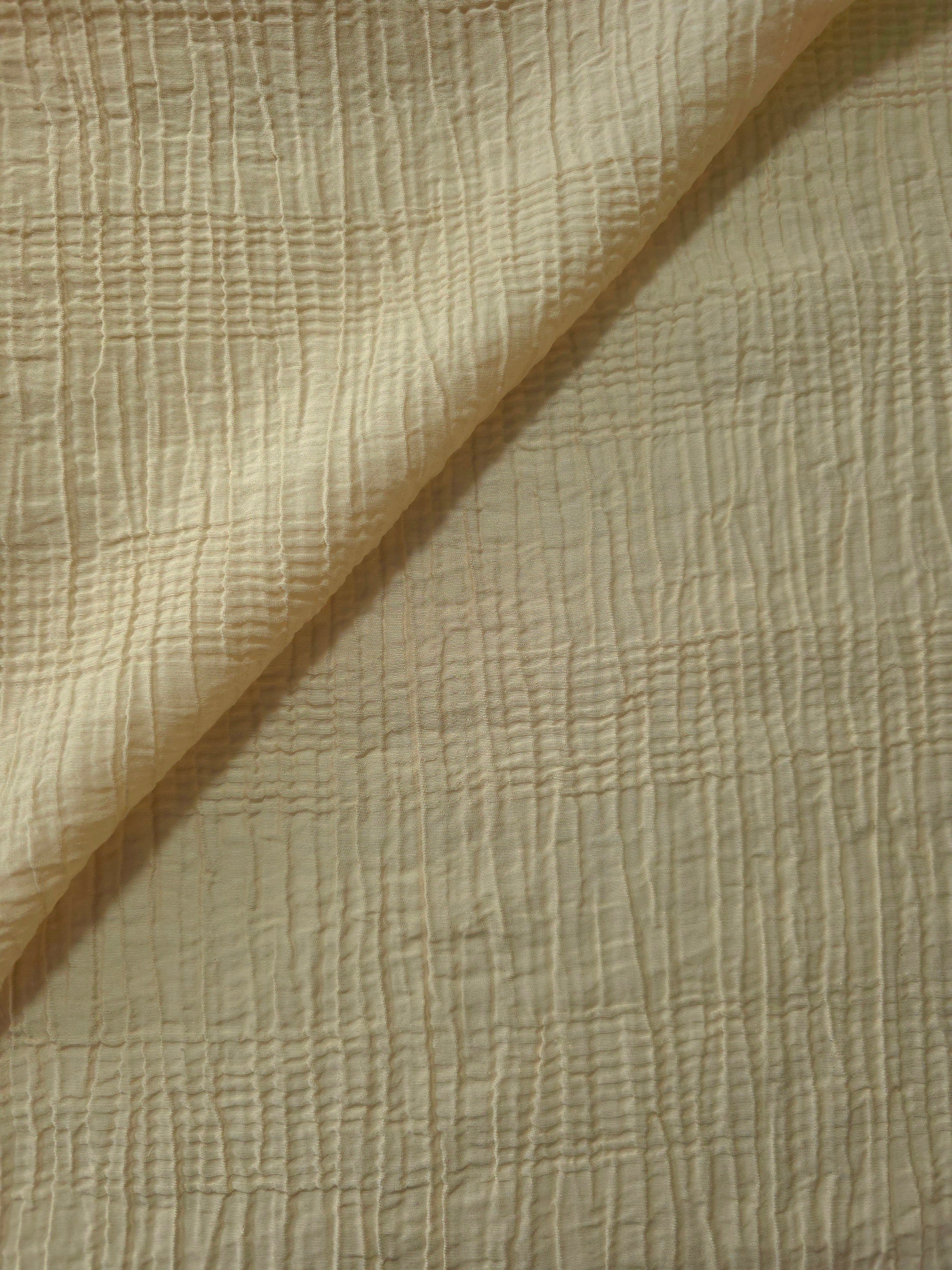 Folded Butter Yellow Tencel jacquard with tonal stripe texture for blouse and skirt layers.