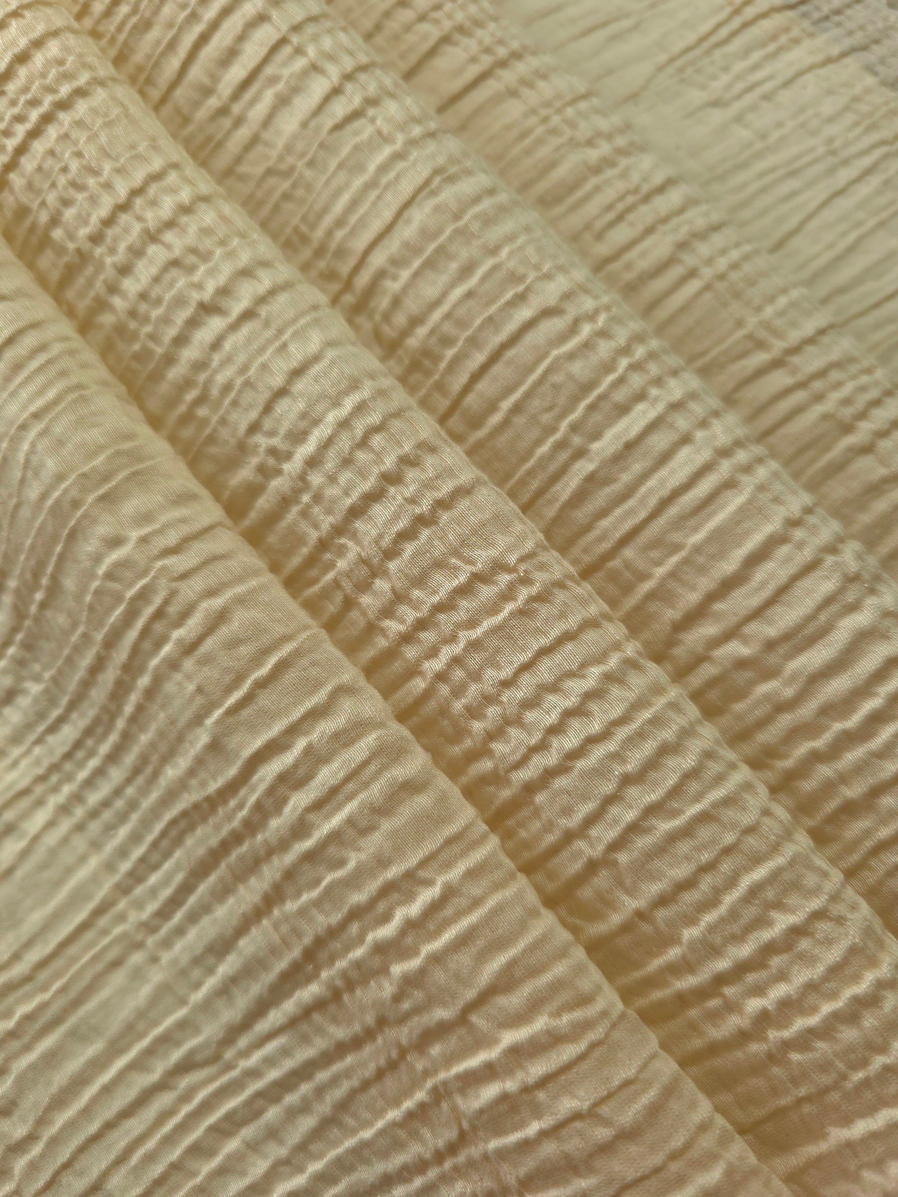 Draped Butter Yellow Tencel jacquard showing airy movement for kaftans and dresses.