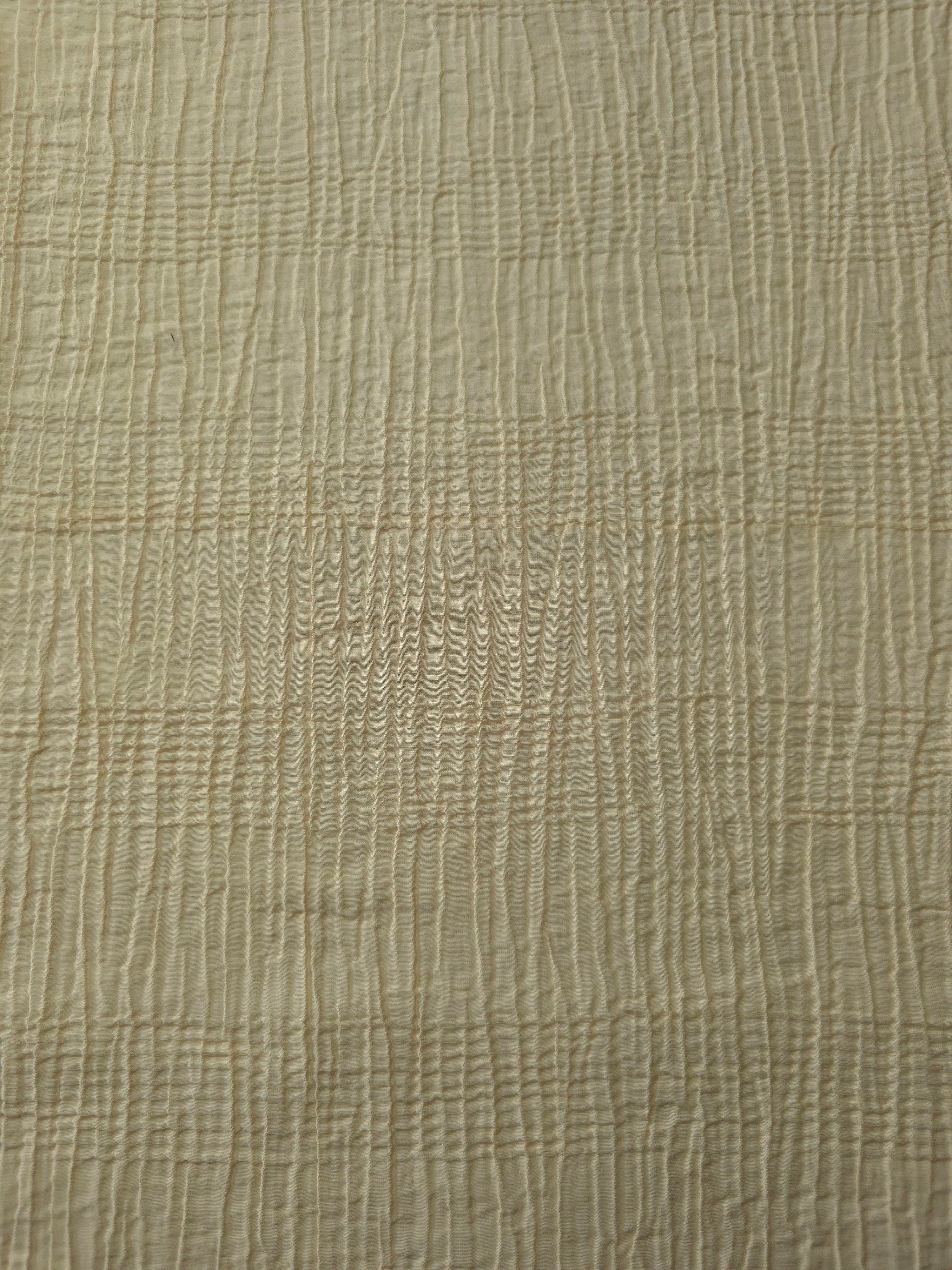 Detail view of Butter Yellow Tencel jacquard with tonal stripe texture for soft layers.